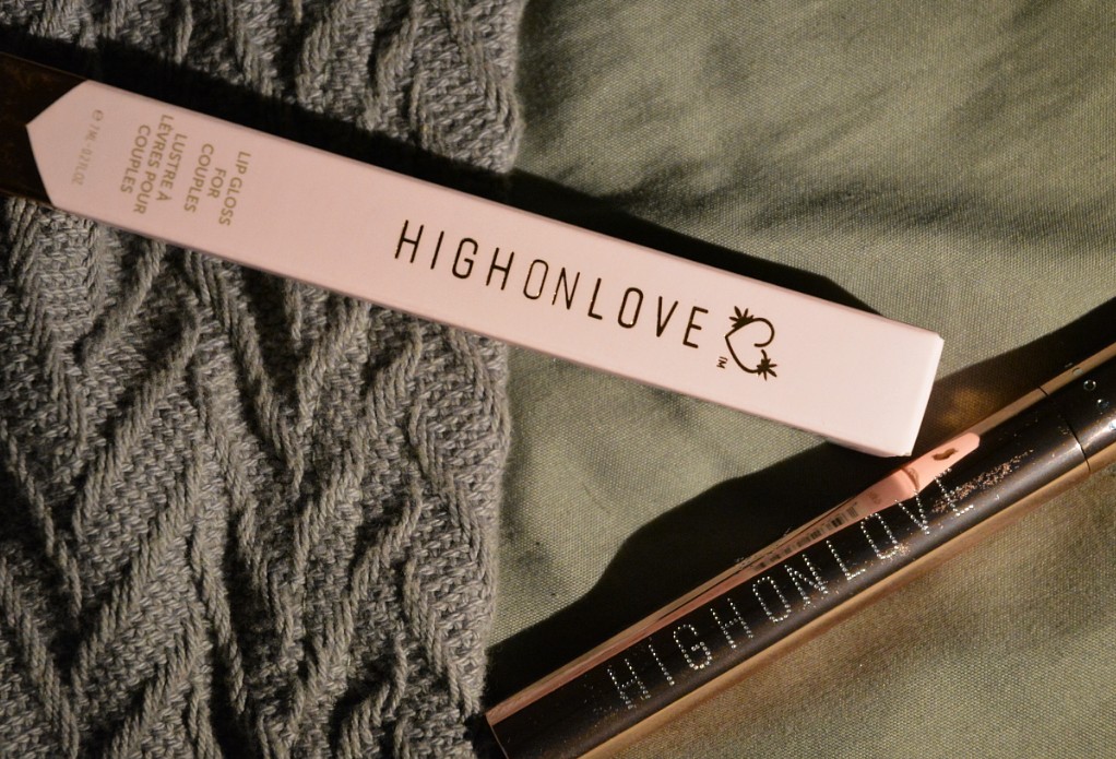 HighOnLove Lip Gloss for Couples on a blanket and sheets.
