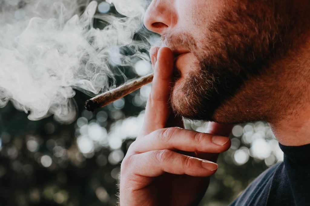 Man smoking a joint.